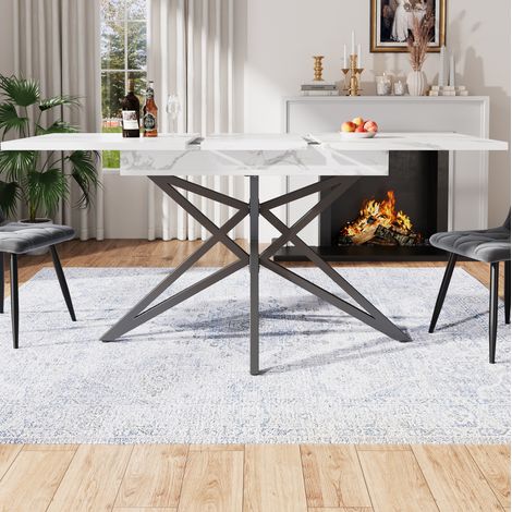 Mesa de comedor extensible 120/160x80x76 cm blanca en MDF y metal con patas en estrella y tablero efecto mármol (1/5)