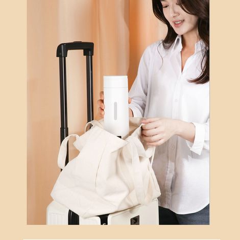 Bouilloire électrique portable 500 ml en acier inoxydable 304 avec isolation thermique, idéale pour les voyages et pour faire bouillir de l'eau. (1/5)
