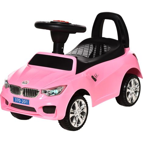 Voiture rose électrique pour enfant avec phares, musique, klaxon, volant, rangement et poignée pour 18 à 36 mois, design ludique pour extérieur pratique