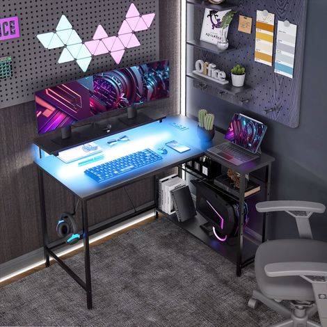 Bureau d'angle réversible, bureau d'ordinateur avec LED, 2 prises et 2 ports USB et panier réglable, 107x80x90cm, noir