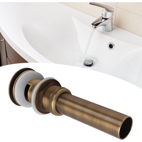 Bonde de lavabo ancienne en cuivre, avec trous, à ressort. (1/5)