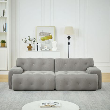 Sofá Cloud, de dos plazas extragrande, con amplios reposabrazos y diseño moderno con detalles de botones. Sofá curvo, ideal para salones y apartamentos. No requiere montaje. Color gris.