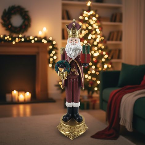 Statuetta decorativa Babbo Natale con pacco regalo, decorazione natalizia in resina da 71 cm (1/4)