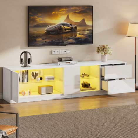 Meuble TV — Doté d'une finition ultra-brillante, de compartiments latéraux éclairés par LED et d'un design bas — Adapté aux téléviseurs de 65 pouces.
