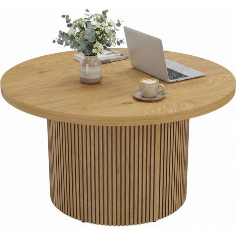 Table basse ronde en bois naturel moderne avec pieds cannelés, élégante pour salon contemporain et déco intérieure raffinée. (1/5)