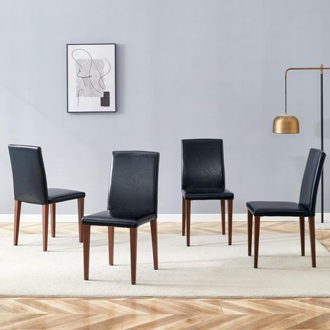 Ensemble de 4 chaises de salle à manger minimalistes. Luxe et légèreté européens, finition noyer noir : cuir PU noir et pieds en métal effet noyer. Idéal pour les salles à manger modernes. (1/5)