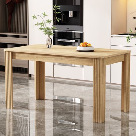 Table à manger rectangulaire couleur chêne en panneaux de particules avec structure stable et montage facile (1/5)