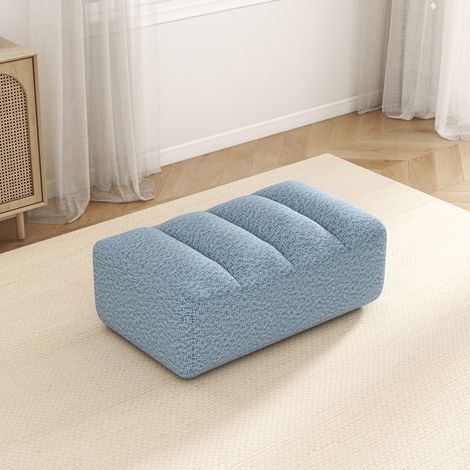 Pouf Bravo en polaire texturée bleu, assise moelleuse, revêtement doux, idéal pour salon ou chambre, design moderne et confortable. (1/5)
