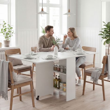 Blanc 75x140x74 cm - Table à manger pliante doté de roues, ailes pliantes et étagères pour 4 à 6 personnes (1/4)