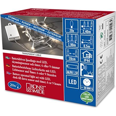 Konstsmide 3722-103 - Catena luminosa LED con interruttore e sensore, timer per 6 e 9 ore, adatta a esterni (IP44), 20 diodi a luce bianca calda, funzionamento a batteria, con cavo trasparente, scatol (1/3)