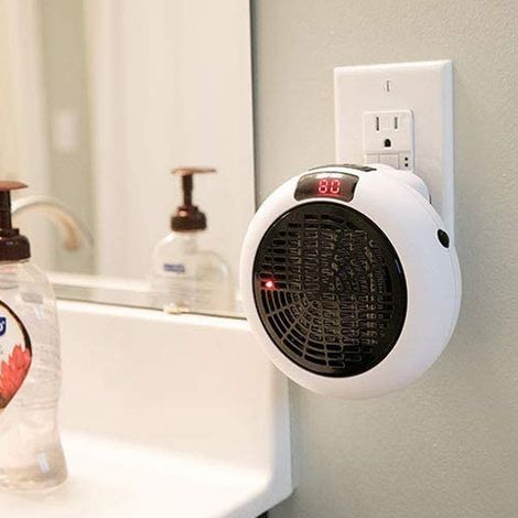 Mini radiateur électrique portable, un produit très populaire pour une utilisation à la maison, au bureau, sur un bureau ou fixé au mur, de forme ronde et électrique. (1/4)