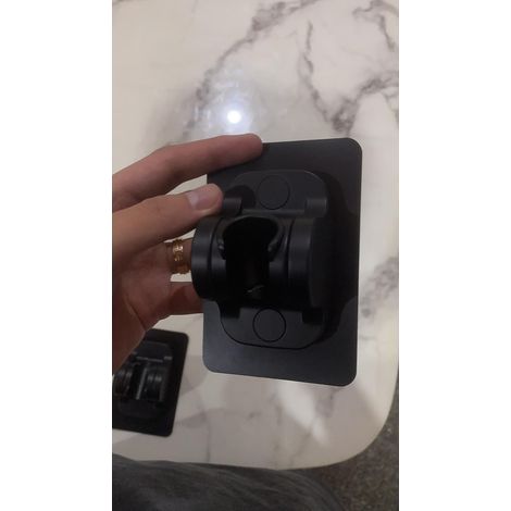 A black, hole-free shower holder with no adhesive residue, a handheld shower holder, a shower head holder, a shower head holder (1/5)