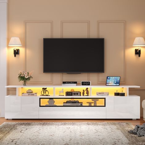 Meuble TV LED blanc brillant 180x38x45cm pour TV 75 pouces, meuble bas salon avec 2 portes, 1 tiroir et rangements ouverts
