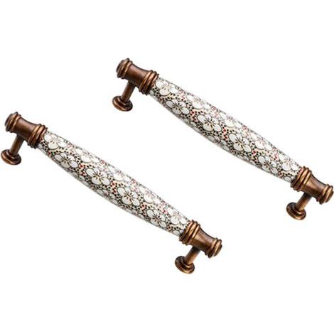 set of two vintage ceramic kitchen cupboard handles, 128 mm center distance, with screws. (1/5)