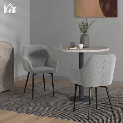 Ensemble de 2 chaises de salle à manger nordiques avec accoudoirs incurvés, revêtues de velours. 54 x 57 x 80 cm. Gris foncé.