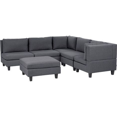 Divano componibile a 5 posti imbottito lato sinistro in tessuto grigio scuro con gambe nere e pouf Unstad