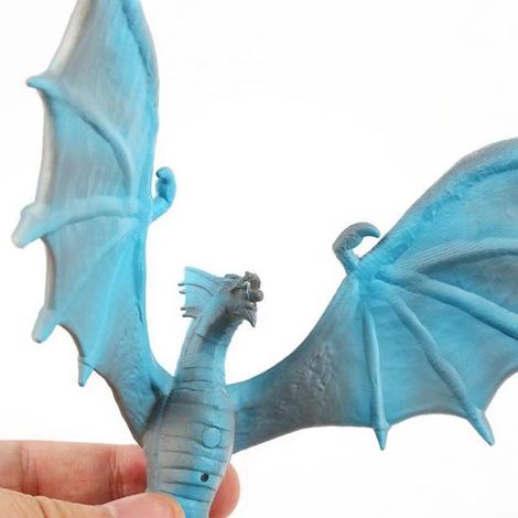 blue and white PLA LED night light 3D printed with a small dragon, an original LED creation.