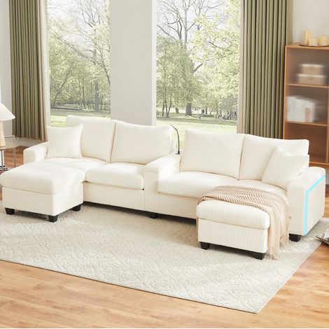 Divano a U 334 x 128,5 x 81 cm in corda beige con contenitore, LED, porta USB/Type-C e 2 pouf (1/5)
