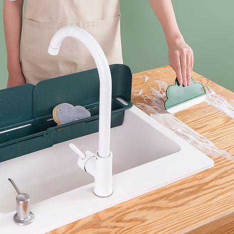Raclette domestique en forme de nuage pour nettoyer les lavabos, les comptoirs de salle de bain en verre et désembuer les miroirs peut être suspendue sur des surfaces blanches. (1/5)