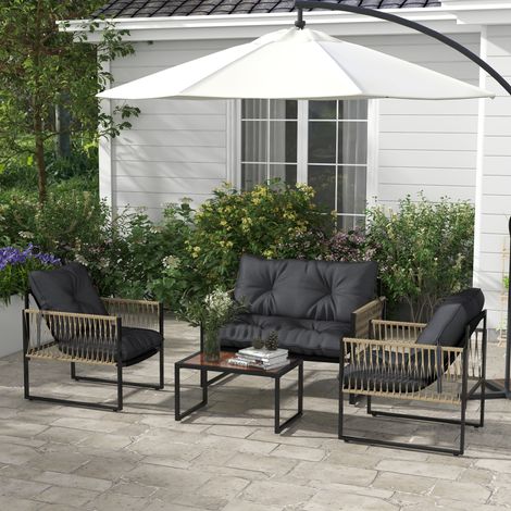 Ensemble de jardin en rotin 4 pièces comprenant un canapé, 2 fauteuils et une table basse. Gris et marron.