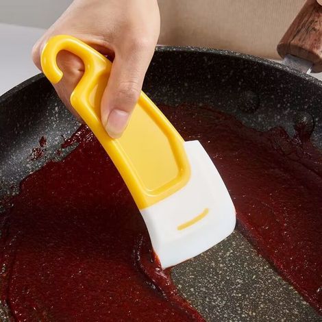 Grattoir jaune pour assaisonnement à pâtisserie, nettoyant cuisine doux et hygiénique en silicone souple. (1/5)