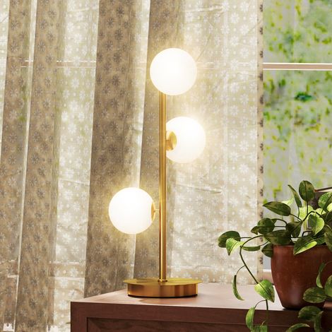 Lampada da comodino con 3 paralumi a globo, lampada da tavolo moderna con base in acciaio e portalampade G9, alta 53 cm, color ottone.