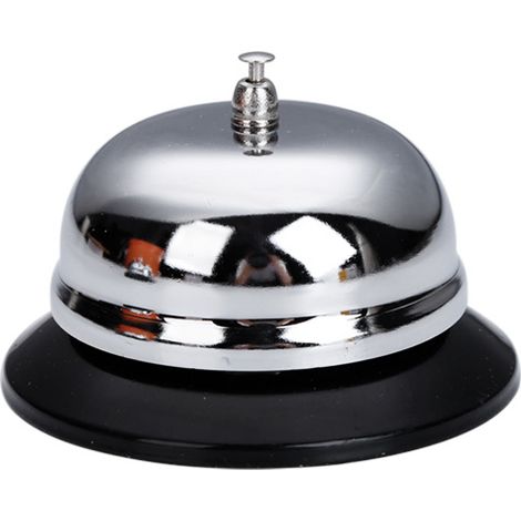 Campana de mesa de metal brillante para recepción de hotel y restaurante.