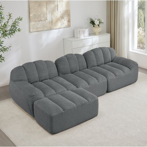 Canapé de esquina modular 3 plazas en tejido fleece granulado gris, sin estructura rígida, con otomana conectable (1/5)