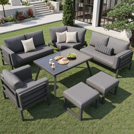 Ensemble de mobilier de jardin en métal gris 8 places avec coussins, table basse en verre, 1 fauteuil et 2 repose-pieds (1/5)