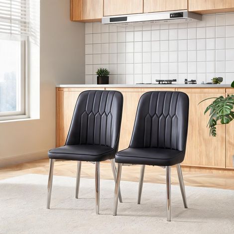 2 chaises de table noires en simili cuir avec piètement métal (1/5)