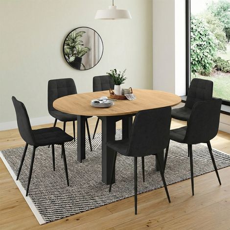 Conjunto de mesa de comedor redonda extensible DONA negra con tablero efecto haya de 110 - 150 cm y 6 sillas MILA de terciopelo