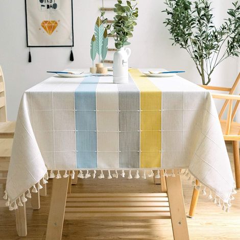 Nappe rectangulaire en coton et lin, coloris uni, à carreaux, avec pompons brodés. (1/4)