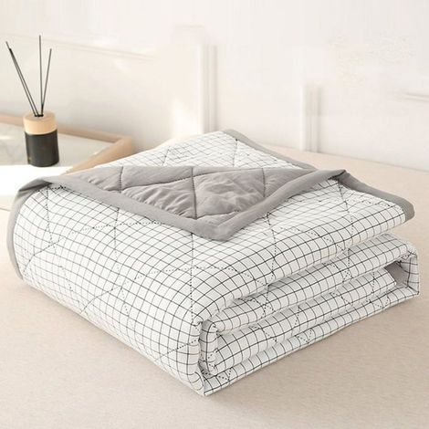 Couette rafraîchissante réversible pour lit simple, idéale pour l'été. Douce et légère, elle est parfaite pour les personnes qui (1/4)