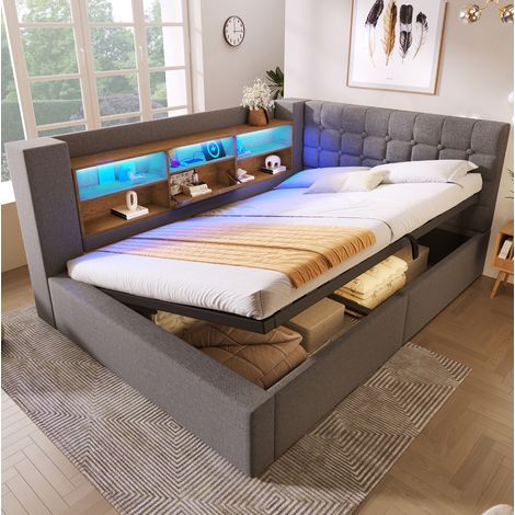 Lit rembourré moderne 140x200 cm en tissu gris avec tête de lit en L réversible, LED, ports USB et coffre (1/5)