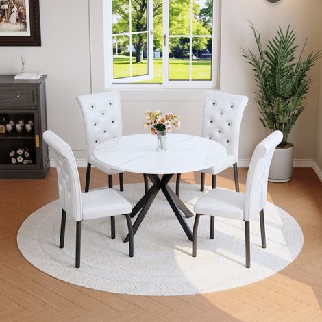Conjunto de comedor, mesa redonda de MDF efecto mármol blanco, estructura X de metal negro y sillas acolchadas (1/5)