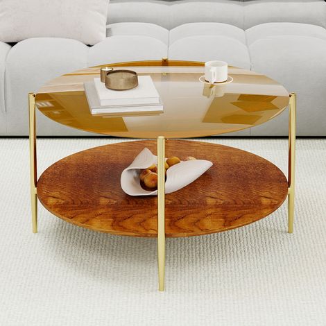 Una mesa de centro minimalista y moderna para el salón, con una tapa redonda de cristal dorado combinada con una base de madera, a la vez estética y práctica. (1/5)