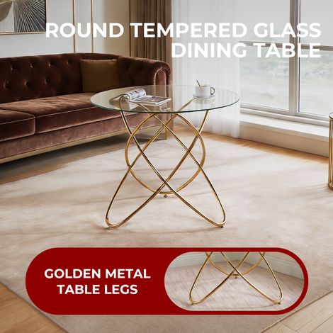 Table de salle à manger moderne en verre trempé avec piètement métallique doré, idéale pour petit espace cuisine ou salon, pieds dorés gain de place