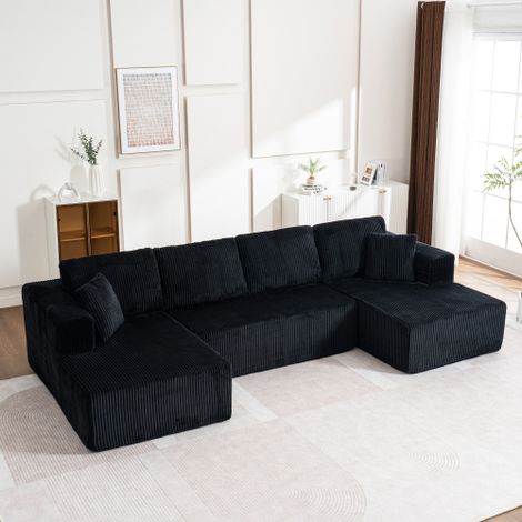 Das Wohnzimmer ist mit einem knochenlosen Sofa kombiniert - einem modernen Leisure-Sofa im U-Typ - mit einem modularen, nicht montierbaren Sofa aus Lampenstoff mit Liegestühlen.