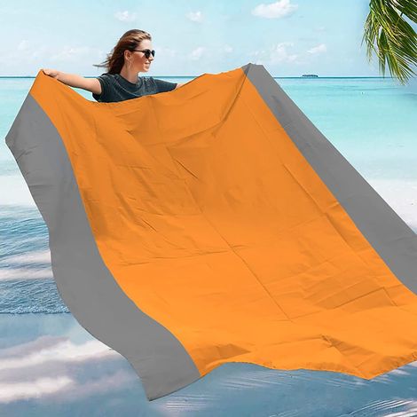 Couverture de plage imperméable et anti-sable, tapis de plage pliable avec 4 piquets d'angle pour le camping, les voyages, les vacances et la randonnée.