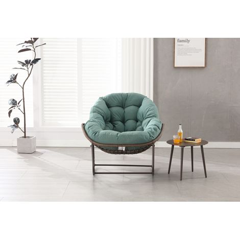 Sillón balancín de exterior en ratán sintético con cojín verde MODENUIT (1/5)