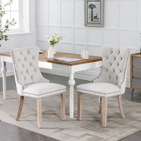 Collection Nikki: 2 chaises lin rembourré, pieds bois, cloutées, beige, style et intemporel