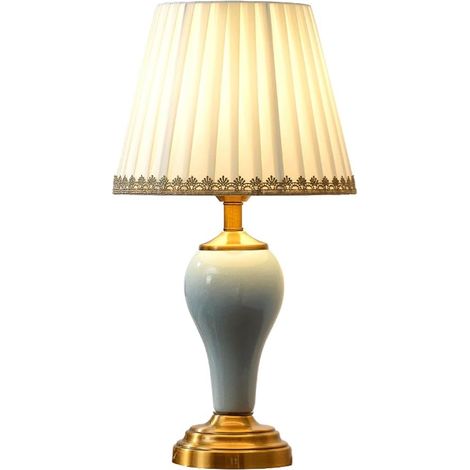 Cette lampe de table en céramique peut servir de lampe de chevet. Son style rétro la rend idéale pour le salon, le bureau ou la salle à manger. (1/5)
