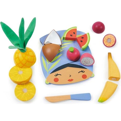 Tabla de cortar de madera con frutas tropicales