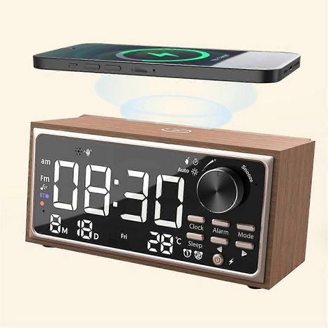 Ce radio-réveil rétro à double alarme est doté d'une recharge sans fil, d'une radio FM, d'un affichage LED et d'une fonction de variation d'intensité lumineuse, ce qui le rend idéal pour une utilisati (1/5)