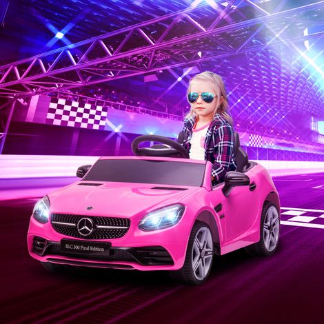 Auto elettrica per bambini Mercedes SLC 300 con licenza ufficiale, 12V, velocità massima 5 km/h, effetti sonori e luminosi, telecomando, colore rosa.