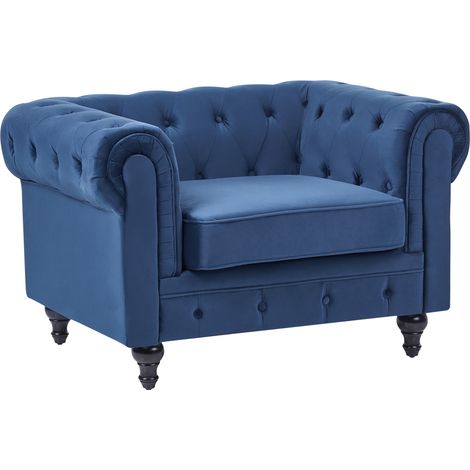 Sillón tapizado de tela de terciopelo azul patas de madera oscura contemporáneo Chesterfield