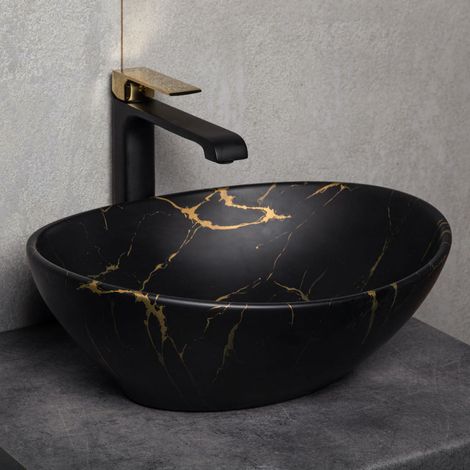 Vasque à poser ovale en céramique – Finition marbré noir mat et or – Dimensions 41.5 x 33.5 cm – Haute résistance chimique et faible porosité – Kerra