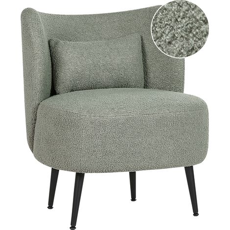 Sillón salón asiento respaldo curvo diseño glamour bouclé tapicería patas negras verde Otsby