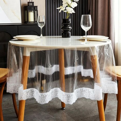 Cette nappe en dentelle transparente est imperméable et possède une finition décorative en plastique, ce qui la rend parfaite pour les fêtes et la décoration intérieure (60 pouces de diamètre). (1/4)