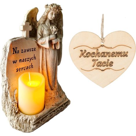 Una candela per il papà, un angelo custode con un'iscrizione e una candela a LED per la tomba.